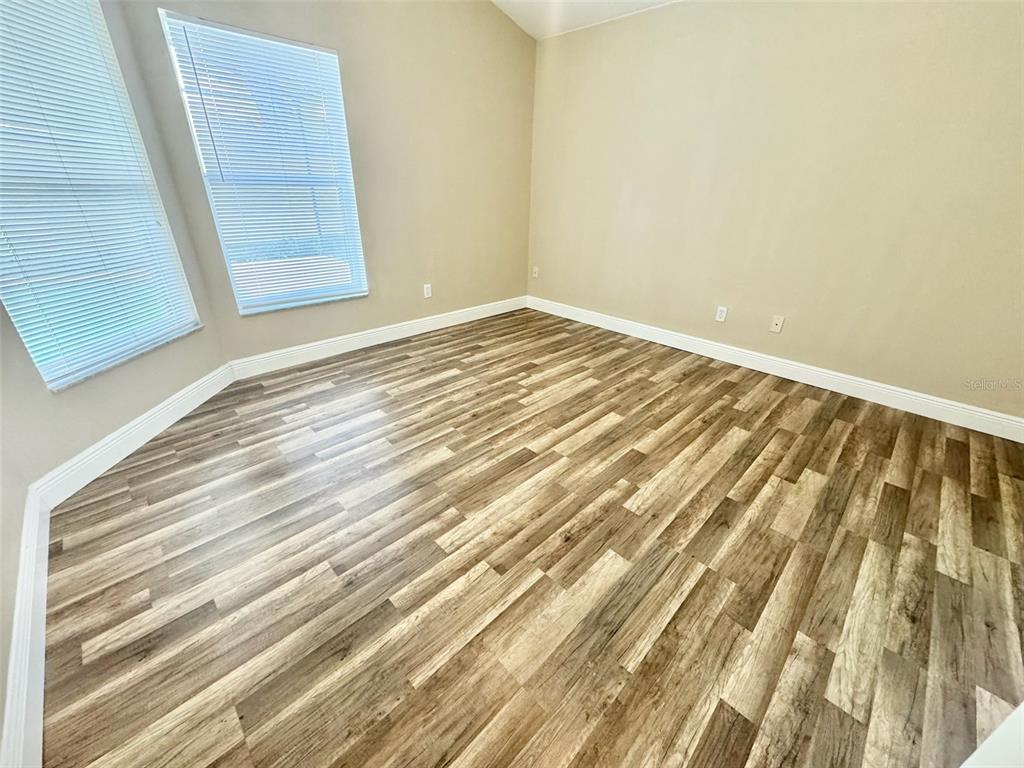 3103 Rawcliffe Road Clermont, FL 34714 - Photo 10 of 17 a view of wooden floor and brick walls