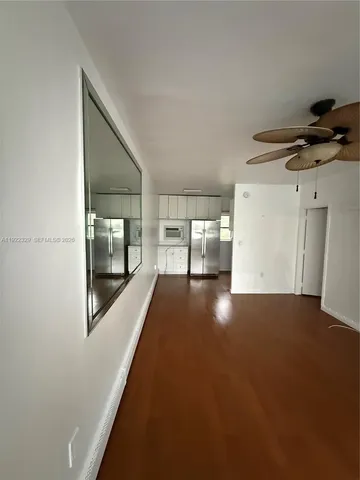 a view of a hallway with paintings on the wall