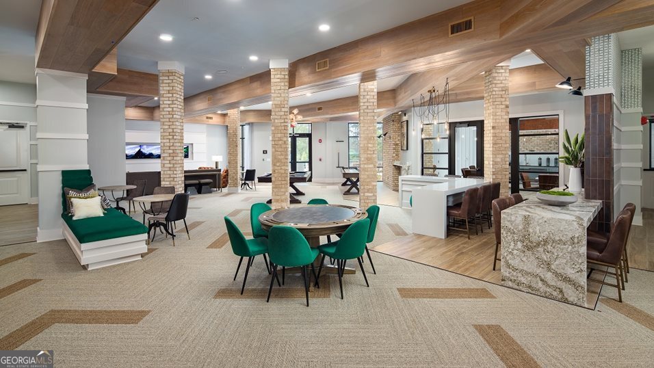 1399 Herrington Road, Unit 1202 Lawrenceville, GA 30044 - Photo 18 of 32 a view of a dining room with furniture