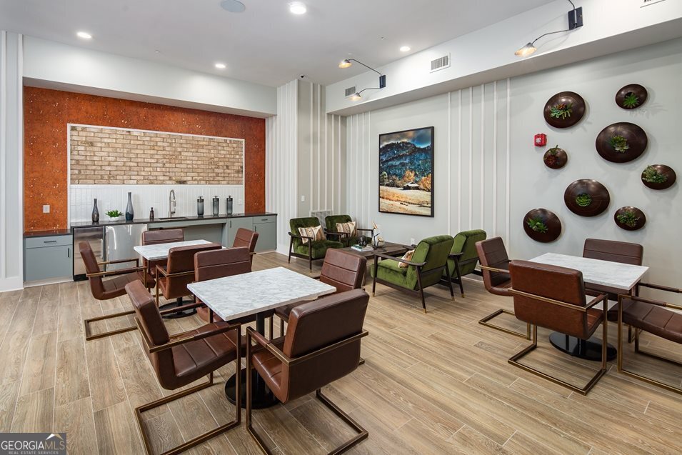 1399 Herrington Road, Unit 1202 Lawrenceville, GA 30044 - Photo 22 of 32 a living room with furniture a rug and a large window