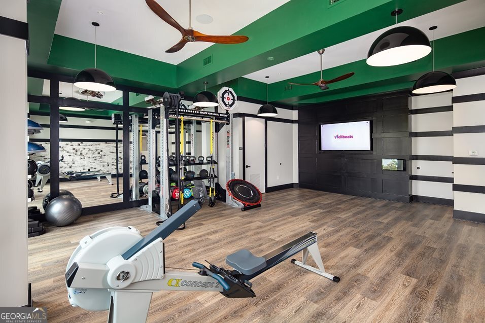 1399 Herrington Road, Unit 1202 Lawrenceville, GA 30044 - Photo 24 of 32 a room with gym equipment and a large window