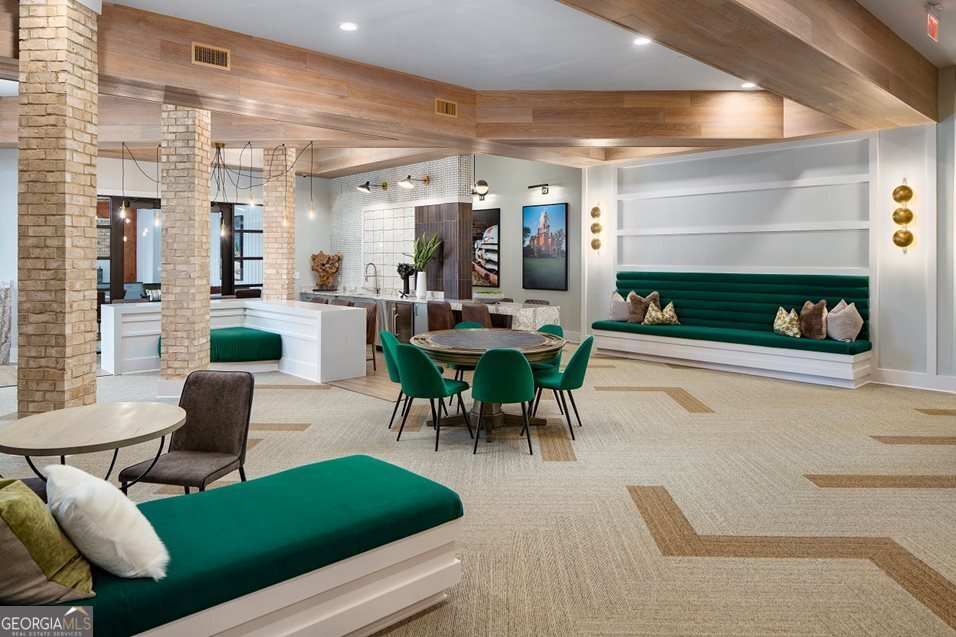 1399 Herrington Road, Unit 1202 Lawrenceville, GA 30044 - Photo 25 of 32 a living room with furniture and a flat screen tv