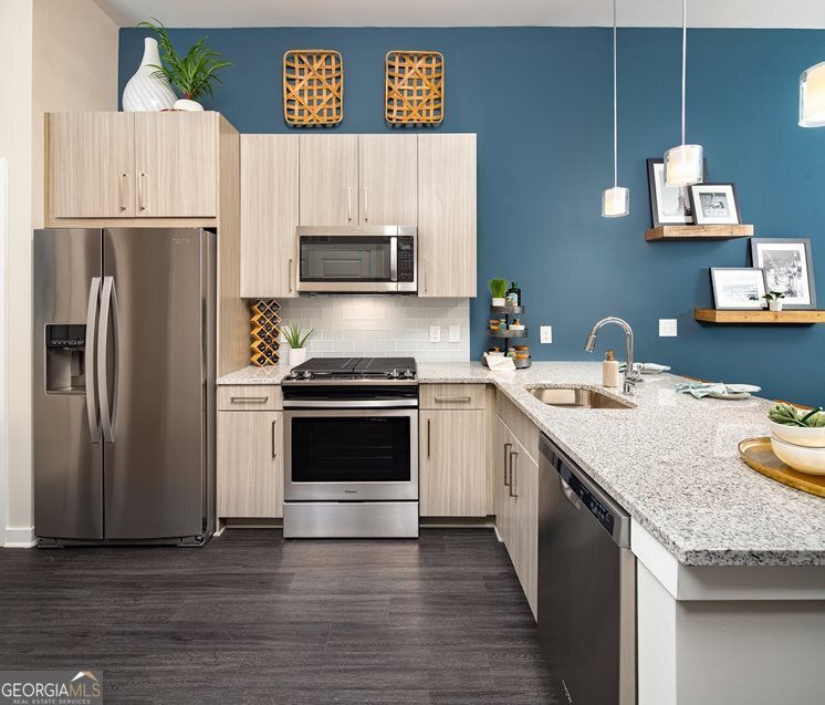 1399 Herrington Road, Unit 1202 Lawrenceville, GA 30044 - Photo 3 of 32 a kitchen with a sink appliances and cabinets
