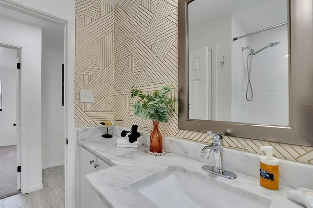 a view of a bathroom with toilet and shower