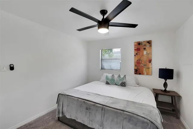 a view of a chair and table in backyard of the house