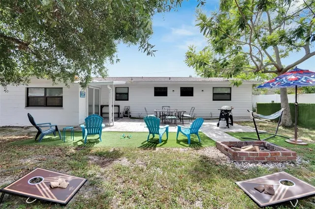 a view of a wooden floor and window in the backyard