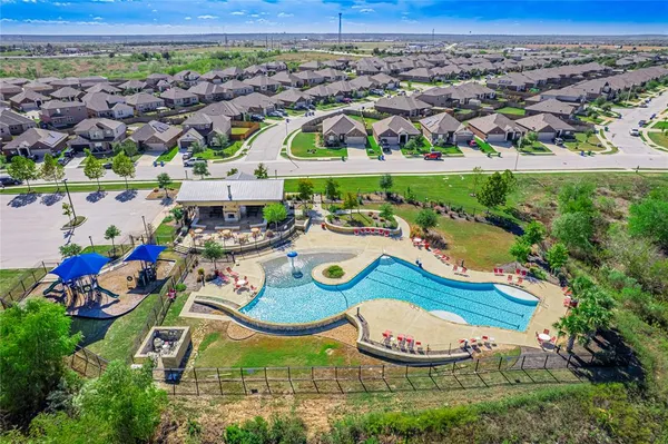 an aerial view of a house and outdoor space
