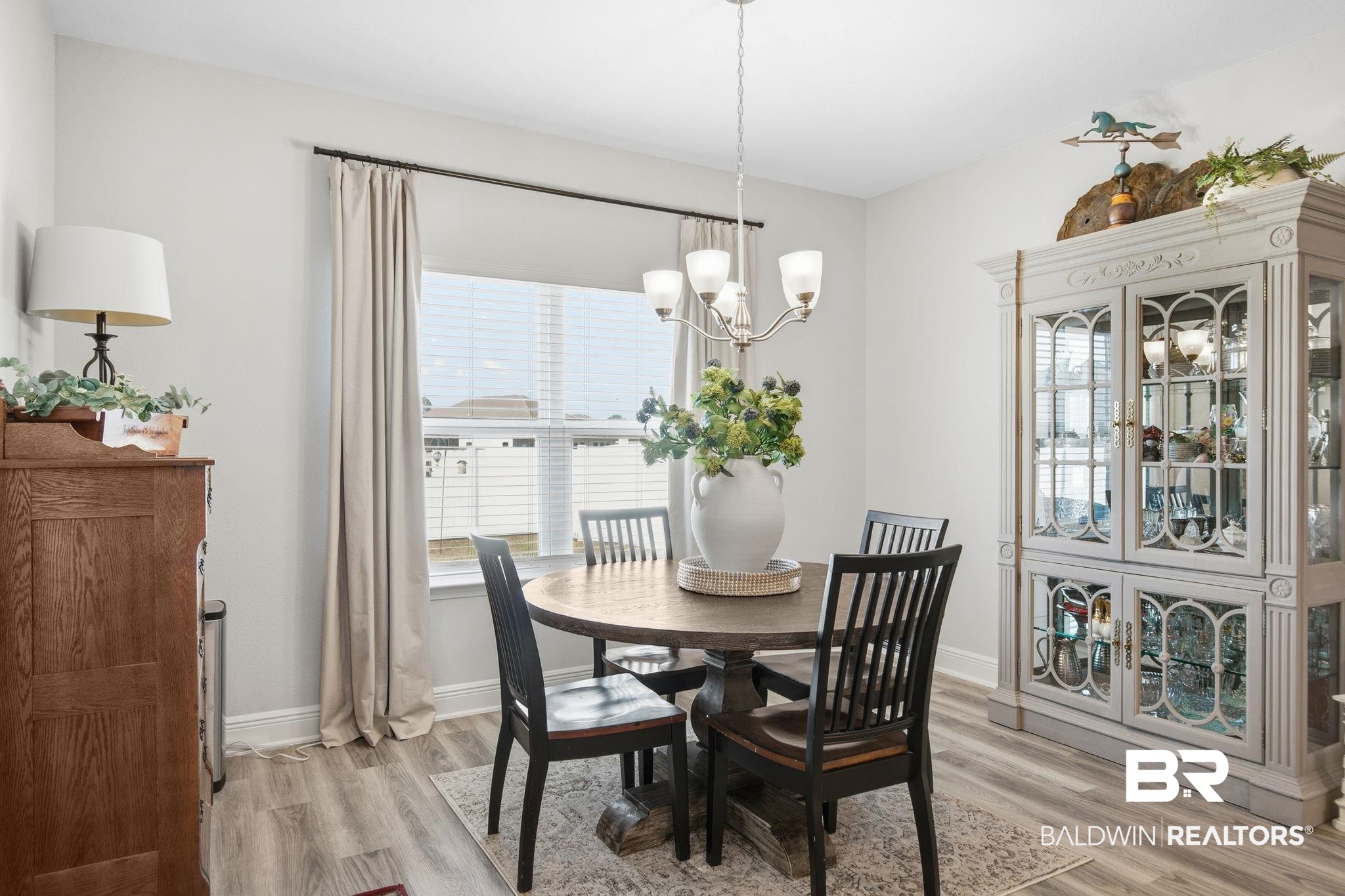 11123 Genuine Risk Circle Daphne, AL 36526 - Photo 23 of 67 Dining room with light wood-style flooring and a chandelier