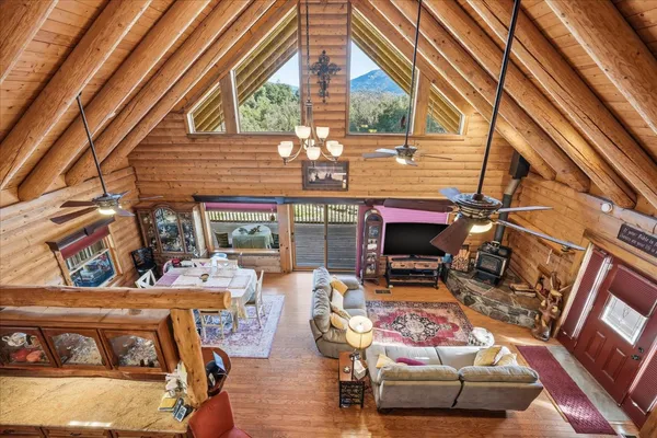 a view of a chairs and table in the balcony