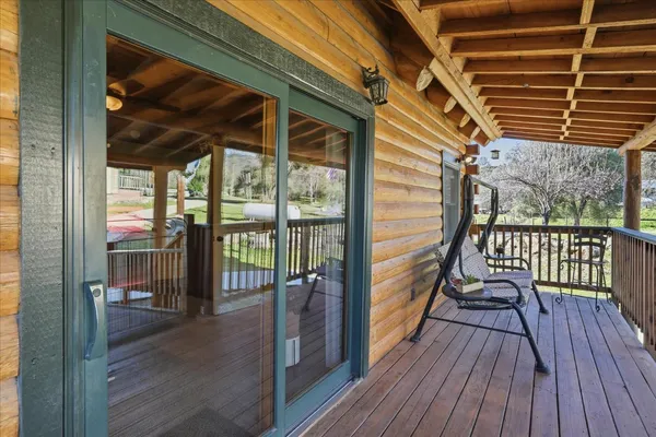a view of a balcony with furniture