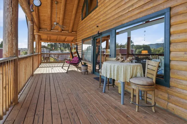 a view of a balcony with furniture