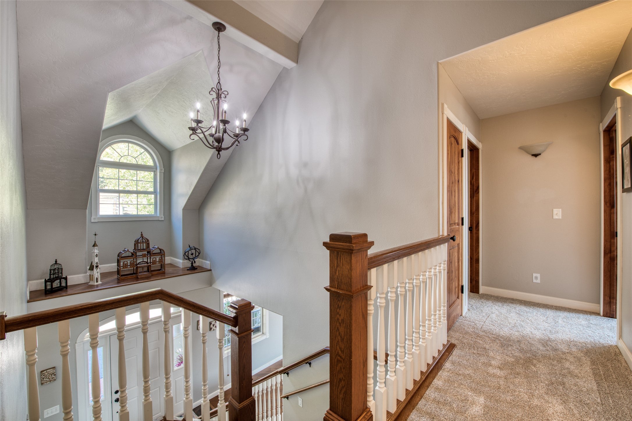 16374 Folsom Road Florence, MT 59833 - Photo 60 of 98 Corridor with a chandelier, carpet flooring, and an upstairs landing