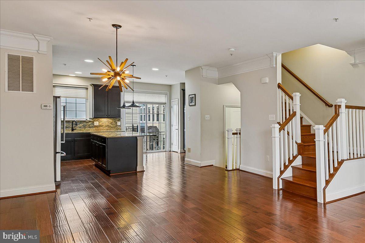 105 Meridian Lane Towson, MD 21286 - Photo 9 of 56 a kitchen with stainless steel appliances kitchen island a refrigerator sink and cabinets