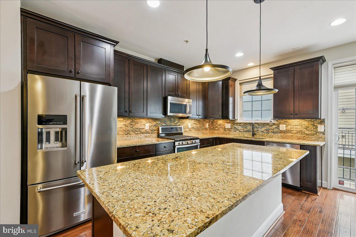 105 Meridian Lane Towson, MD 21286 - Photo 15 of 56 a kitchen with stainless steel appliances granite countertop a refrigerator a sink and a stove