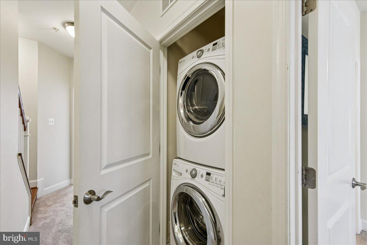 105 Meridian Lane Towson, MD 21286 - Photo 34 of 56 a view of a hallway with washer and dryer
