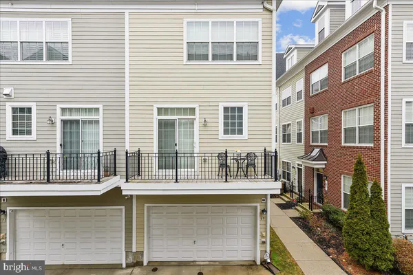 a view of a brick house with a balcony