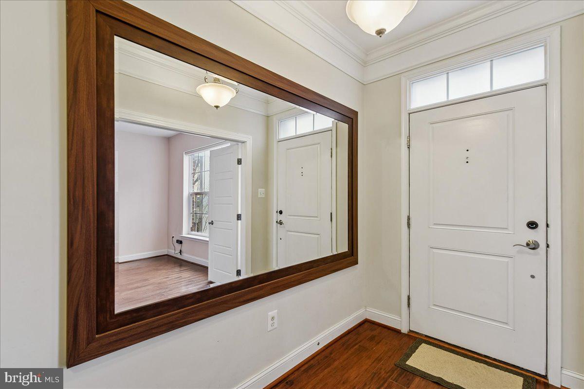 105 Meridian Lane Towson, MD 21286 - Photo 3 of 56 a view of a hallway with wooden floor