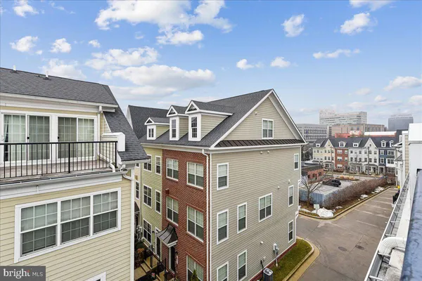a front view of a building with a lot of windows