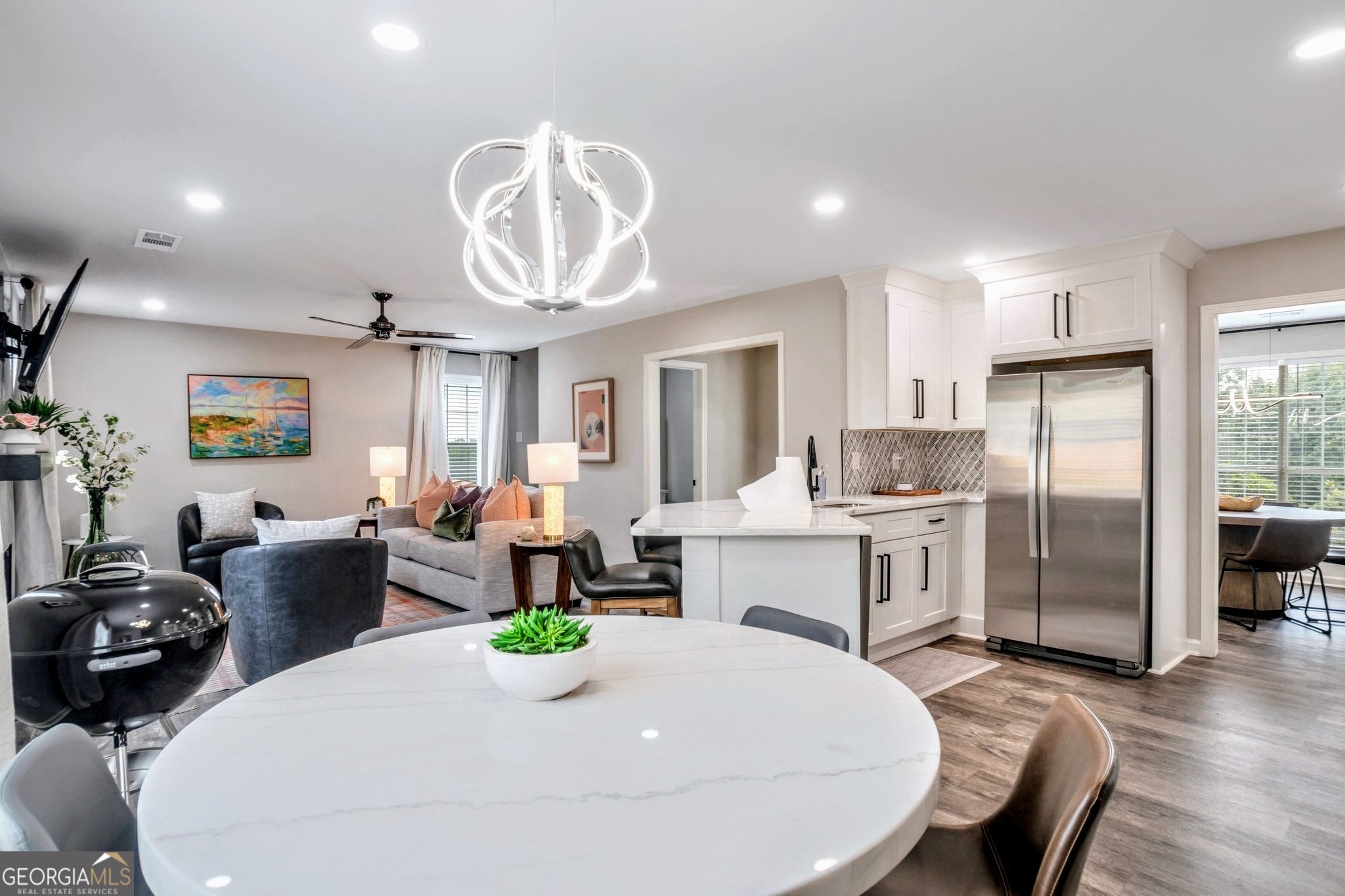 8008 Clearview Circle Riverdale, GA 30296 - Photo 12 of 31 a very nice looking dining room with kitchen island furniture a refrigerator a sink and a dining table