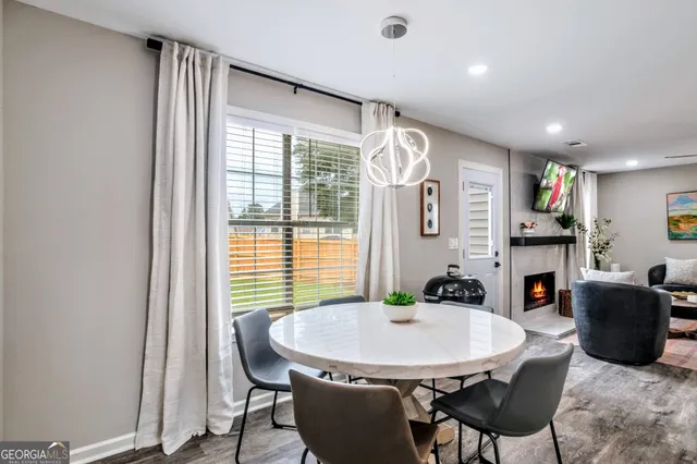 a dining room with furniture and window