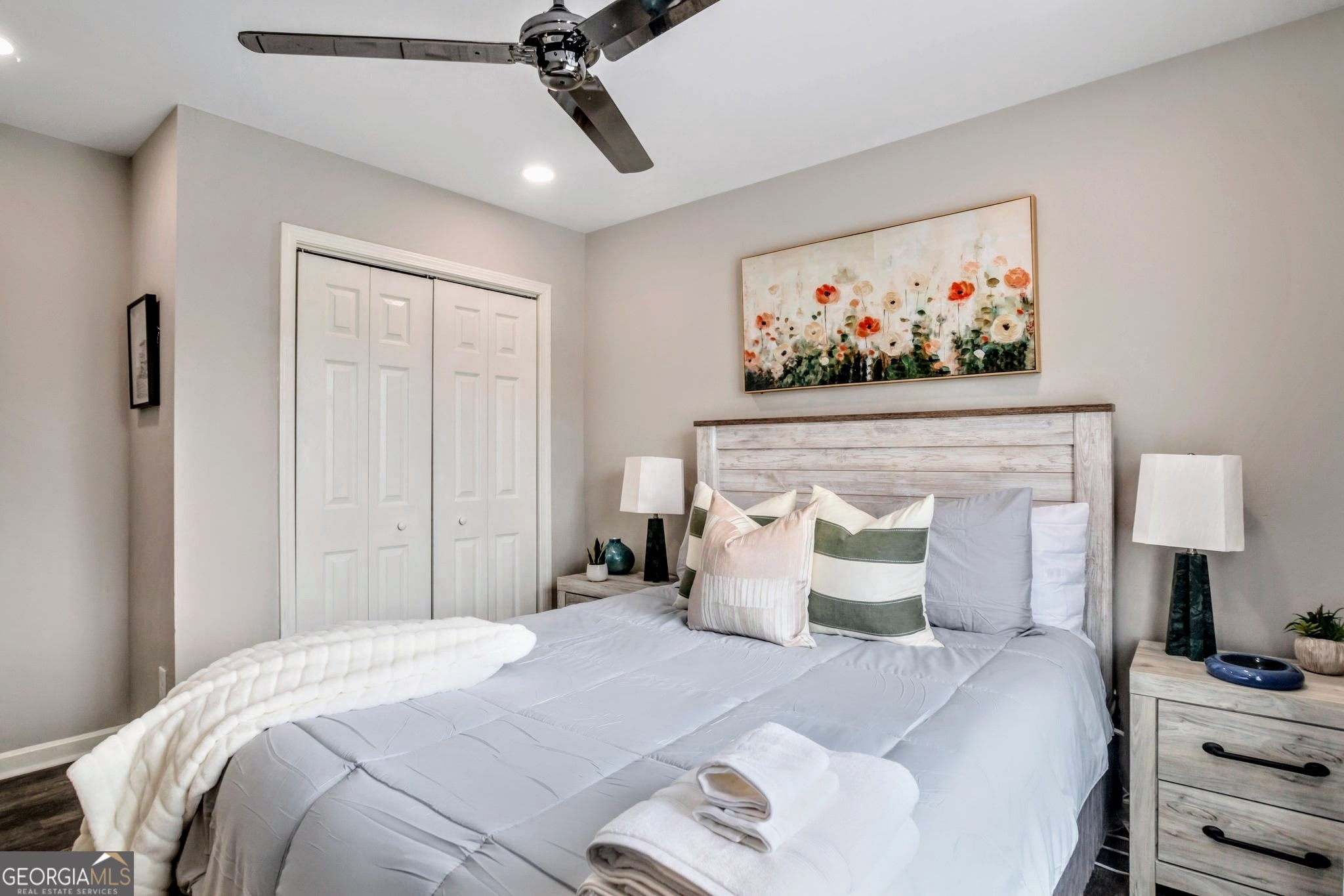 8008 Clearview Circle Riverdale, GA 30296 - Photo 16 of 31 a bedroom with a bed and a painting on the wall