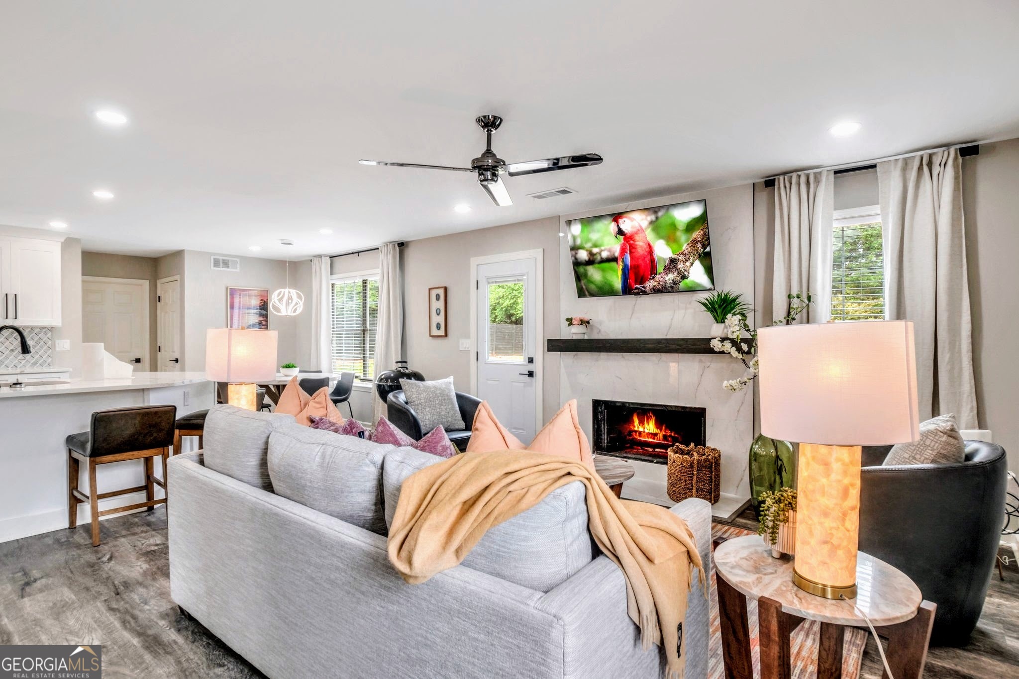 8008 Clearview Circle Riverdale, GA 30296 - Photo 2 of 31 a living room with fireplace furniture and a flat screen tv