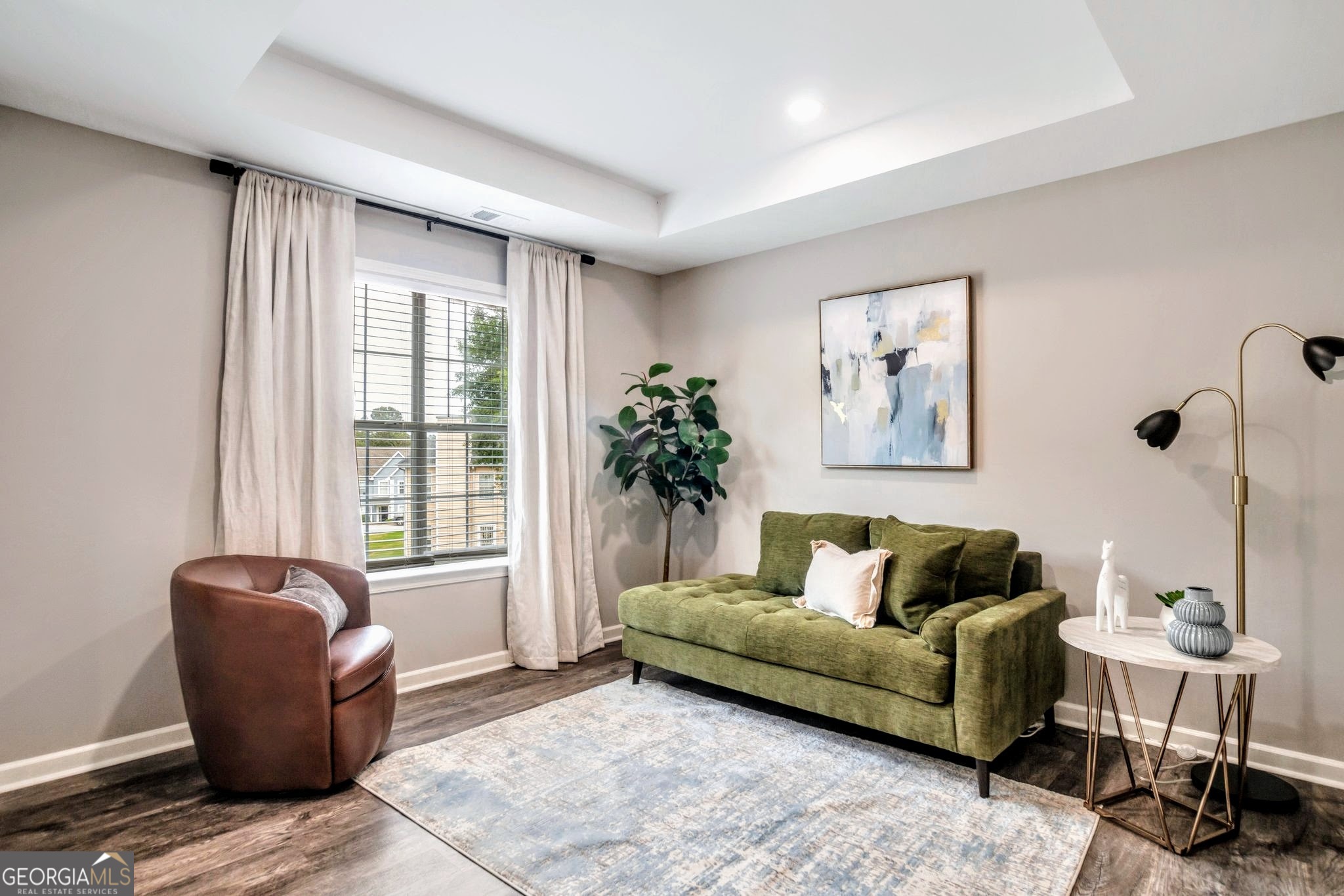 8008 Clearview Circle Riverdale, GA 30296 - Photo 21 of 31 a living room with furniture and a window