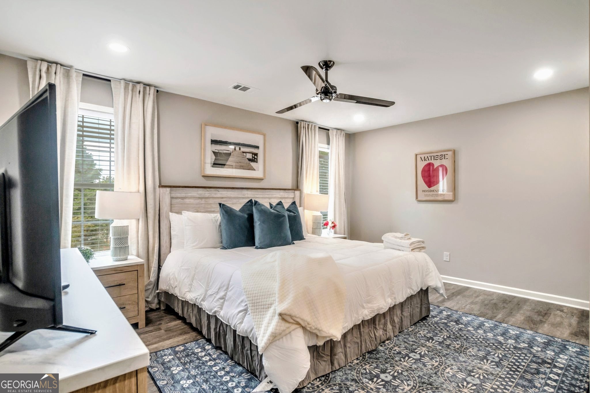 8008 Clearview Circle Riverdale, GA 30296 - Photo 24 of 31 a bedroom with a large bed and a window