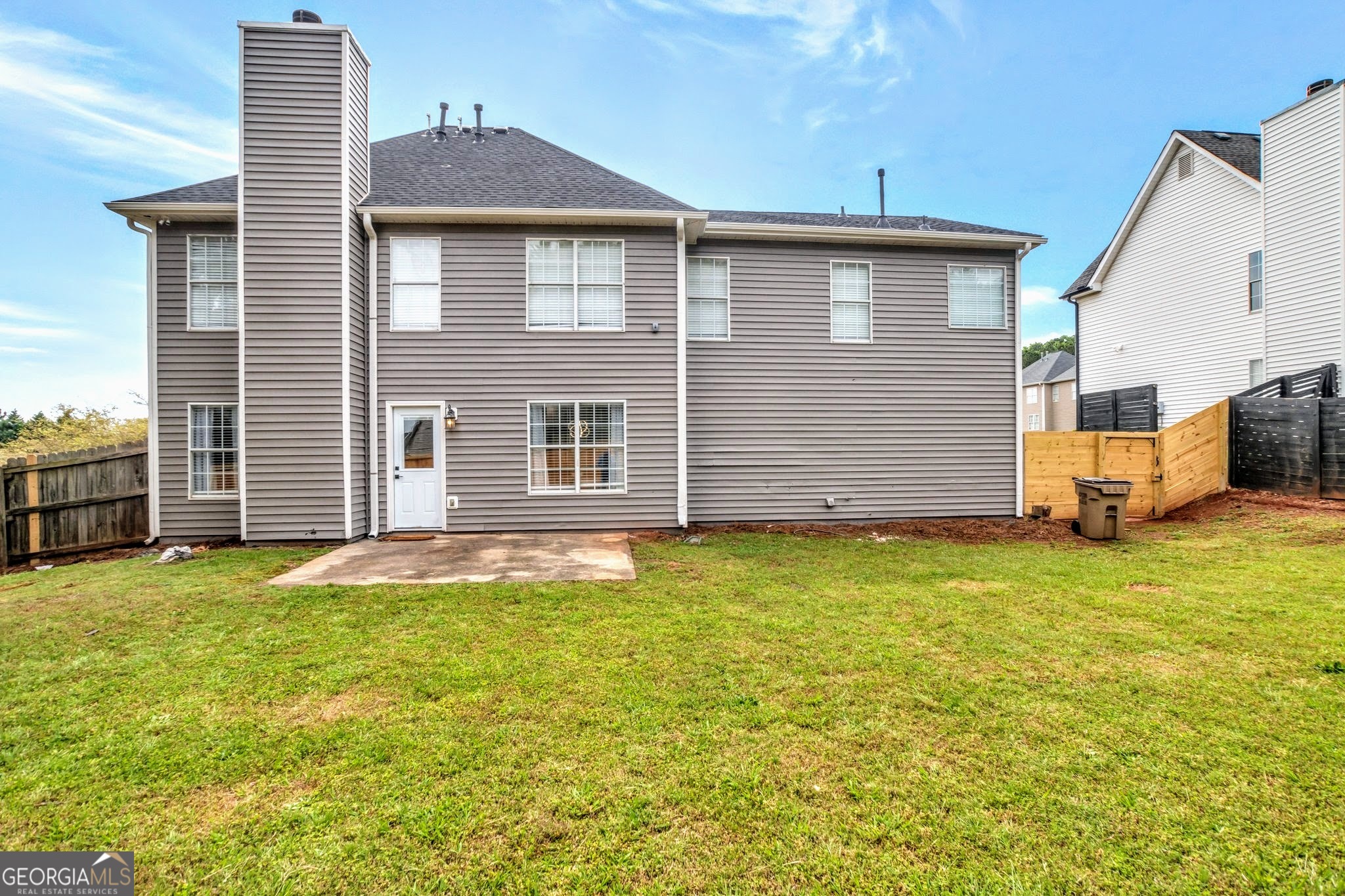 8008 Clearview Circle Riverdale, GA 30296 - Photo 26 of 31 a front view of a house with a garden and yard
