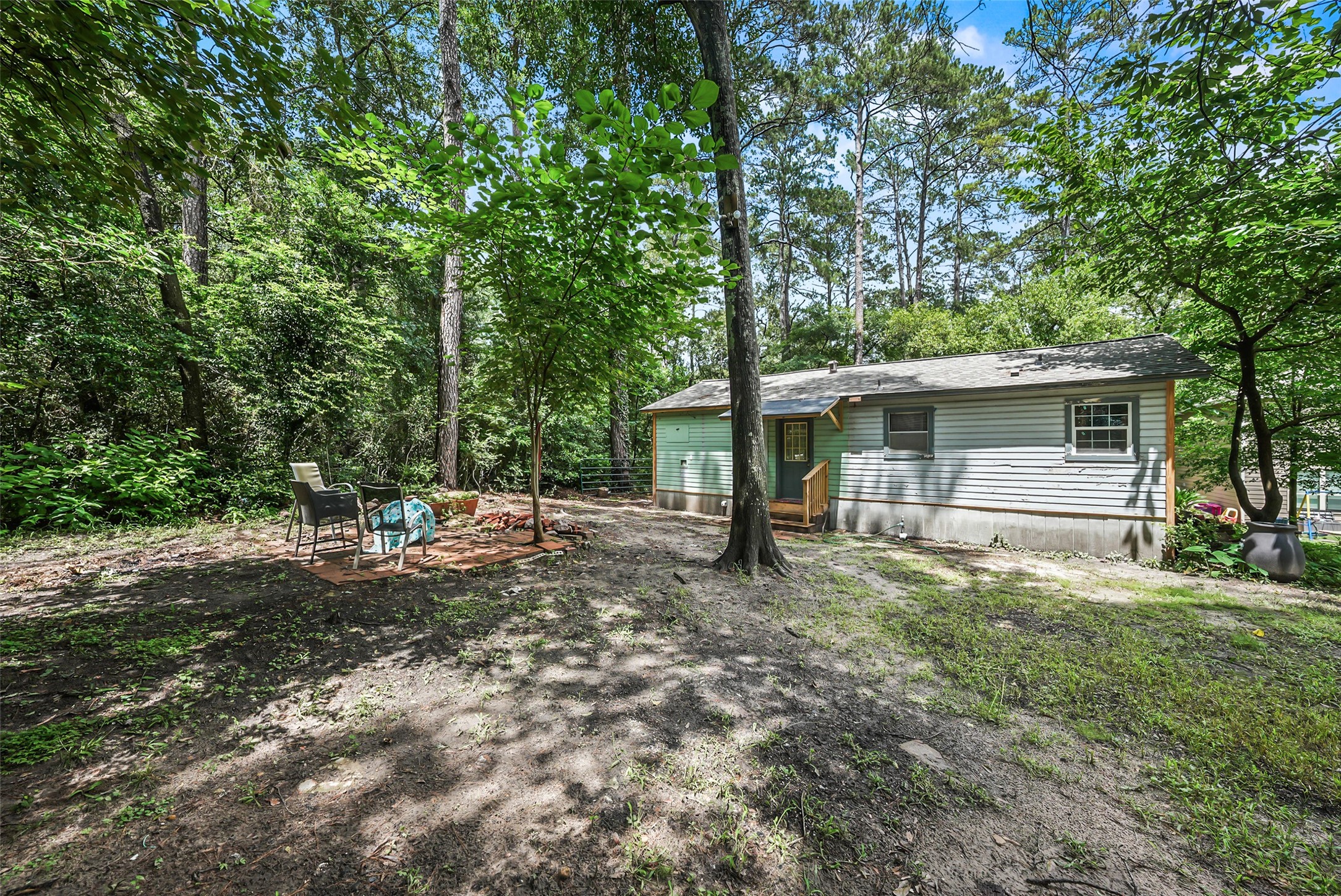 6387 Oak Knoll Road Montgomery, TX 77316 - Photo 23 of 30 a view of a house with a yard