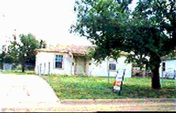 4127 South Polk Street Amarillo, TX 79110 - Photo 1 of 1 a view of a white house with a big yard and large tree