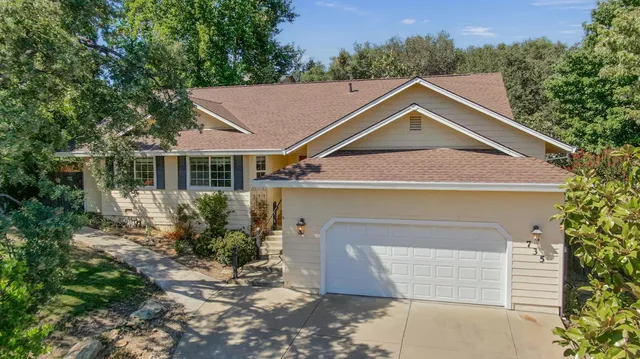 a house with trees in the background