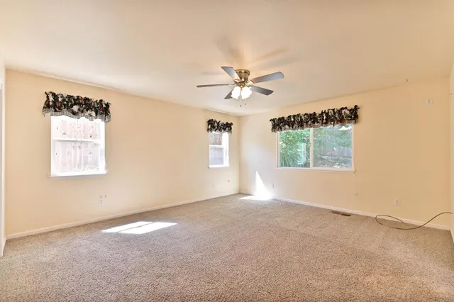 a view of an empty room with stairs