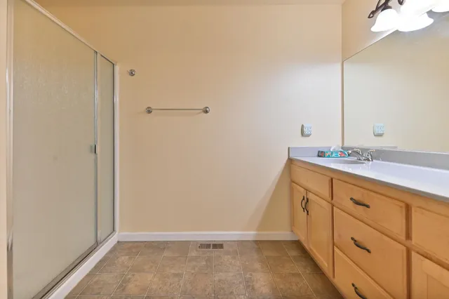 a view of yard with swimming pool and green space