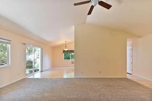 a view of a kitchen with granite countertop stainless steel appliances cabinets a sink and a counter top