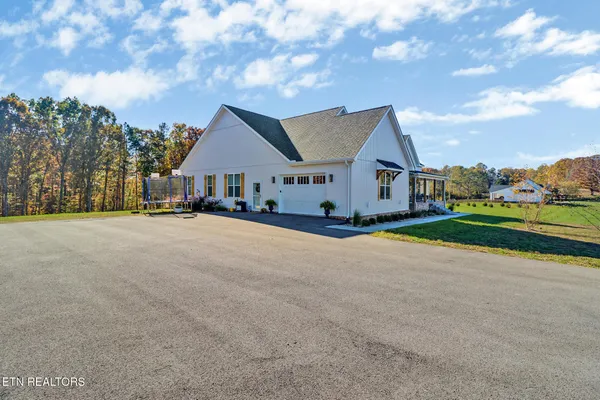 a view of large house with a big yard