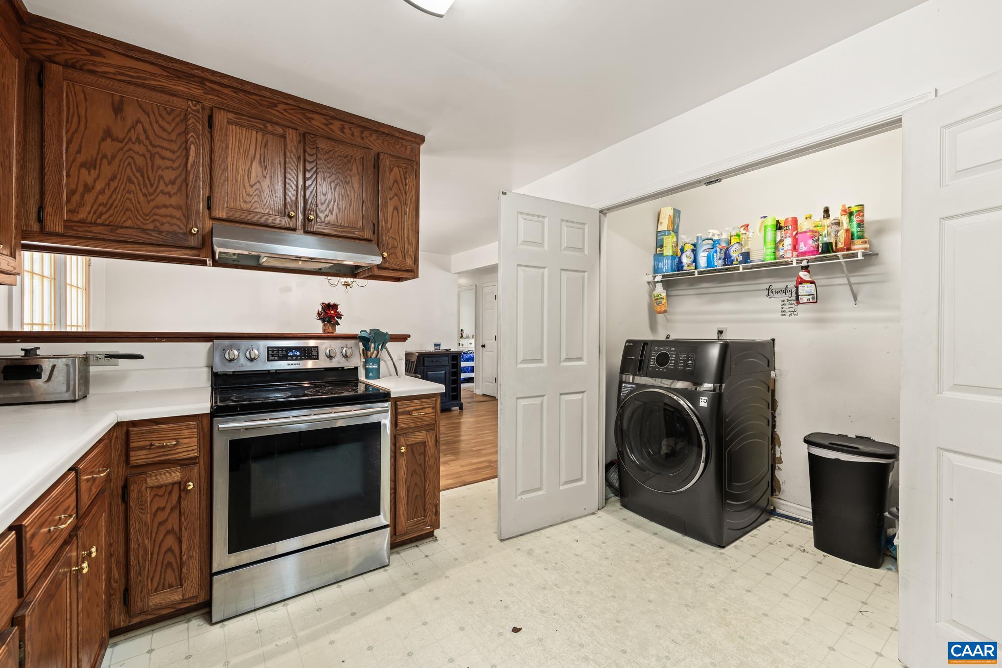 858 James River Road Scottsville, VA 24590 - Photo 12 of 33 a kitchen with stainless steel appliances granite countertop a stove a washer and dryer