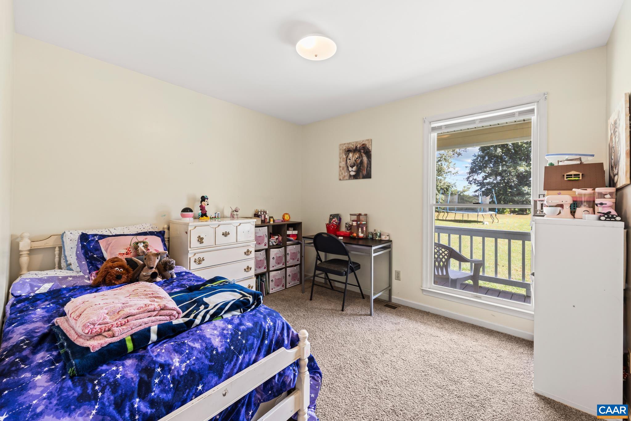 858 James River Road Scottsville, VA 24590 - Photo 18 of 33 a bedroom with a bed and a window
