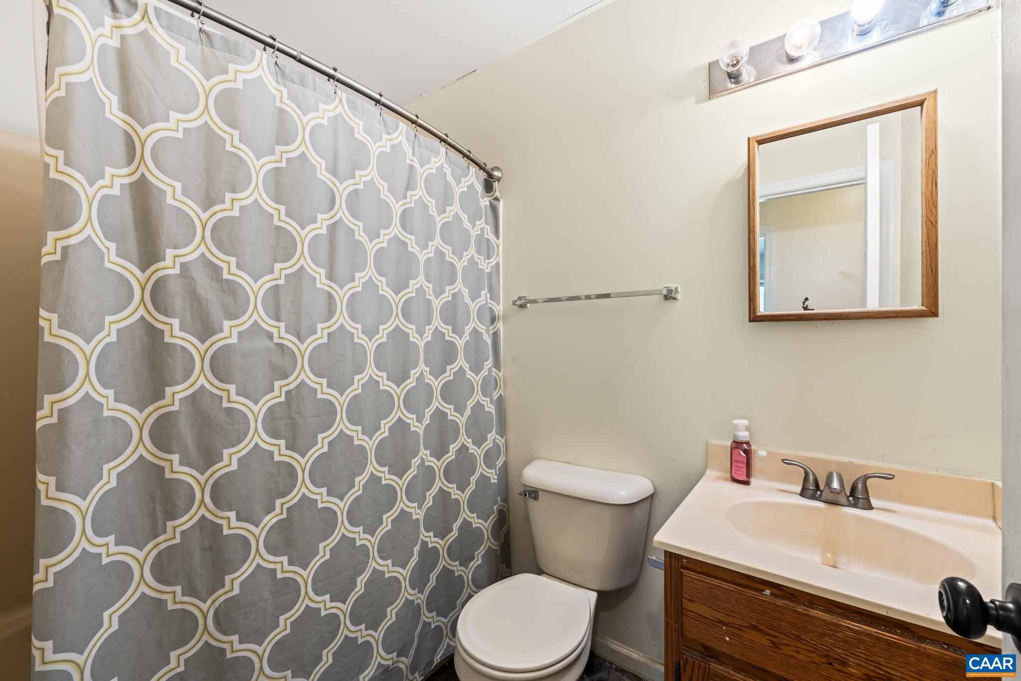 858 James River Road Scottsville, VA 24590 - Photo 19 of 33 a bathroom with a sink and a mirror