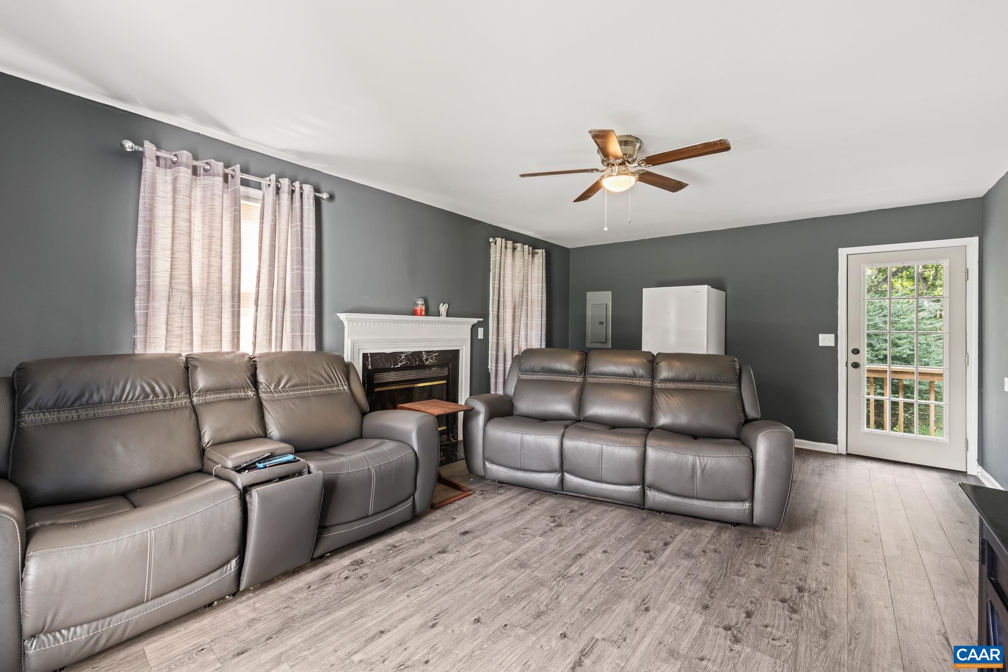 858 James River Road Scottsville, VA 24590 - Photo 21 of 33 a living room with furniture a ceiling fan and a window