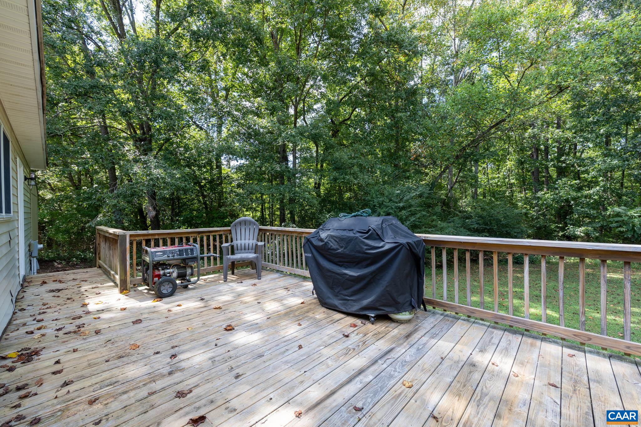 858 James River Road Scottsville, VA 24590 - Photo 22 of 33 a view of backyard with deck and outdoor seating
