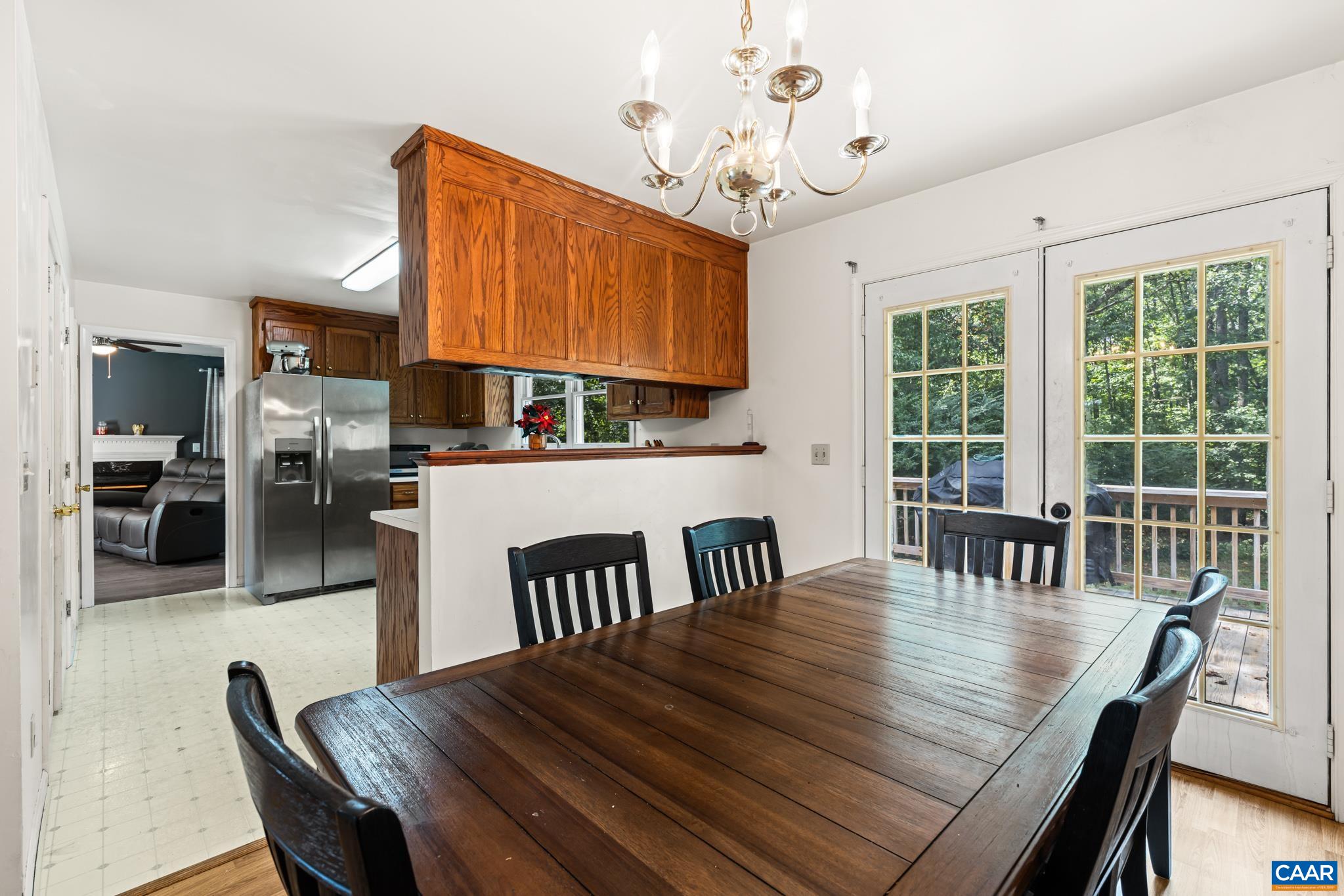 858 James River Road Scottsville, VA 24590 - Photo 5 of 33 a view of a dining room with furniture window and wooden floor