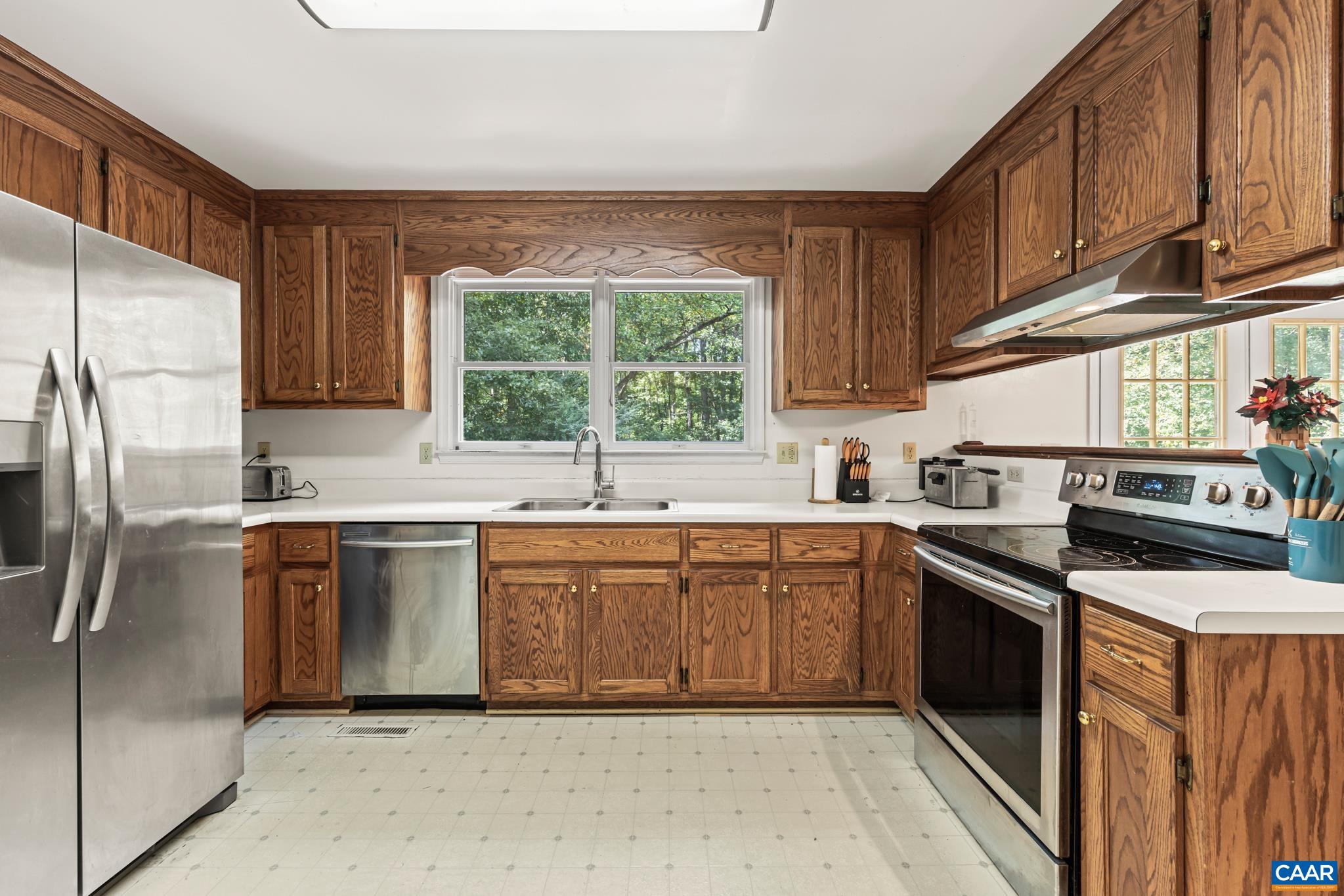 858 James River Road Scottsville, VA 24590 - Photo 6 of 33 a kitchen with stainless steel appliances granite countertop a stove a sink dishwasher and a refrigerator