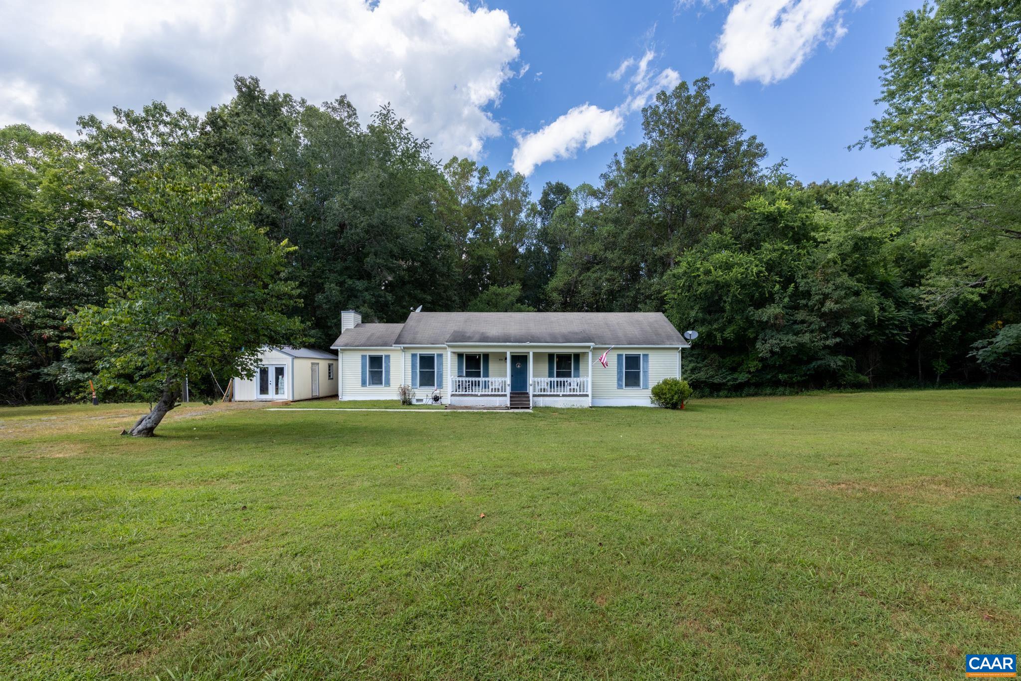 858 James River Road Scottsville, VA 24590 - Photo 9 of 33 a front view of a house with a garden