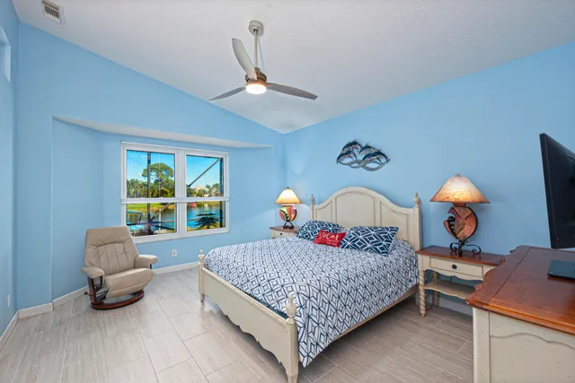 a living room with a bed furniture and a window