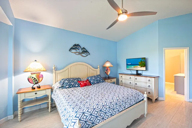 a bedroom with a bed and a dresser in it