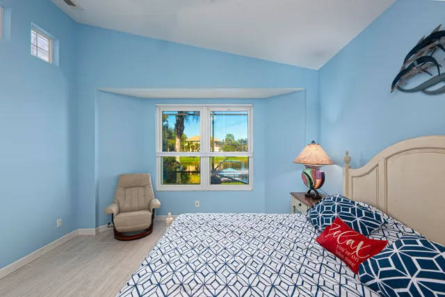 a bedroom with furniture and a window