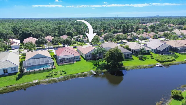 a view of a swimming pool yard and outdoor seating