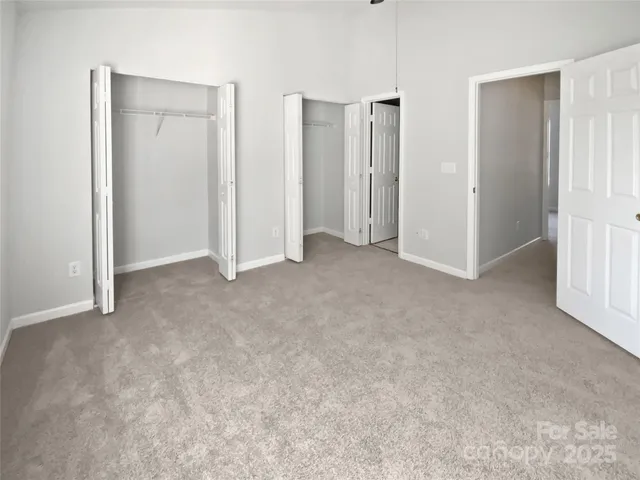 an empty room with closet area