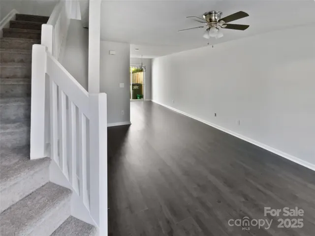 a view of a hallway with a white walls